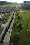 Graduates file onto the Great Lawn at the beginning of the graduation ceremony. - Photo by Kathleen Murray