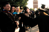 Faculty members David Malone, Theresa Blakley and Pam Sutton interact with gradates as they file onto the Great Lawn for spring graduation. - Photo by Kristen Nicole Sayres