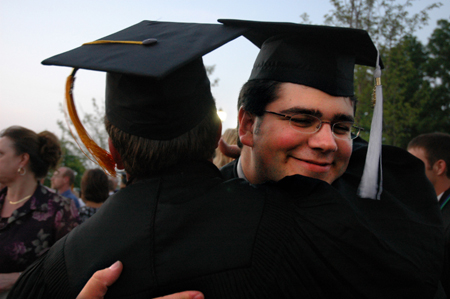 Broadcasting graduate Jonathan Yorkowitz gets a congratulatory hug after the spring graduation ceremony.