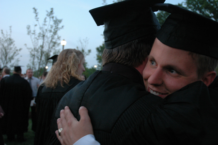 Youth ministry graduate Ryan Martin gets a congratulatory hug after the spring graduation ceremony.