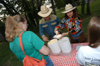 Keith and Beverly Absher dip out a cool treat for graduating senior Lindsey Barnes during the Happy Trails social at the Dockery's.  Keith is the Dean of the McAfee School of Business Administration and Beverly is the Director of Human Resources at Union. - Photo by Morris Abernathy