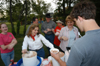 Graduating Senior Kyle Edwards enjoys some cool treats during the Happy Trails social at the Dockery's.  Serving him is Penney Smith and Sandy Abernathy. - Photo by Morris Abernathy