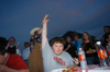 Graduating Senior Jonathan Blair prevails in the hotwings eating contest during the Happy Trails  social at the Dockery's. - Photo by Morris Abernathy