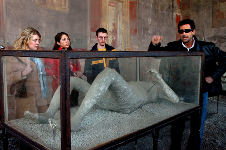 Arts in Western Civilization students get a glimpse of the first hand view of Pompeii on the annual Italy study tour.  Pictured from left to right are Beth McDowell, Liz Connava, Ron Holley and the Italian tour guide.