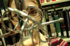 Senior Sharon Hart, history major, stares through the handle of a rappier sword, which she recently wrote about in her third place award-winning senior seminar paper. - Photo by Jonathan Blair