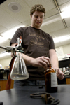 Senior Brent Jones, biology and chemistry major, prepared his research on monomer reactions for the Union University Scholarship Symposium. - Photo by Kathleen Murray