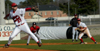 Charlie Ligon (27) pitches as Josh Allen (11) holds the runner at first base. - Photo by Kathleen Murray