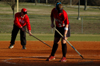 Head Coach Brian Dunn and pitcher Chrissa Norton take care of field preparation prior to one of Union's home games at Fesmire Field. - Photo by Amanda Herron