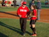 Head Coach Brian Dunn talks strategy with senior outfielder Allison Shein. - Photo by Amanda Herron