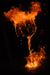Senior Ariel Gee lights up one of his fire sculptures. - Photo by Jonathan Blair