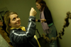 Beth Pierce, April Wright and Allison Steele hang Pierce's three-dimensional line project. - Photo by Jonathan Blair