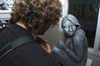 Senior Tim Weisemann examines a piece by Cindy Keegan before the Sculpture Workshop Reception in the Art Gallery. - Photo by Jonathan Blair