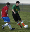 Intramural Soccer Action - Brandon Nelms covers Justin Hutto. - Photo by Jonathan Blair