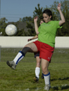 Intramural Soccer Action - Sniper Kathryn Kiper sends the ball skyward. - Photo by Jonathan Blair