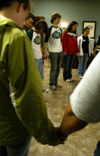Members of SAC circle together for prayer prior to the Spring Thing 2005 concert with Scratch Track and Sanctus Real. - Photo by Kristen Nicole Sayres