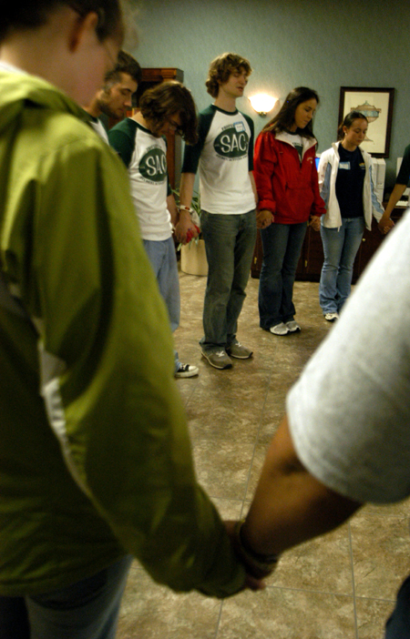 Members of SAC circle together for prayer prior to the Spring Thing 2005 concert with Scratch Track and Sanctus Real.