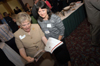 First Lady Lanese Dockery (left) reviews a profile of Laura Lee Moore in the latest edition of the Unionite with Laura Lee's mother Linda Moore ('73) during the dessert reception at the Southern Baptist Convention.  - Photo by Morris Abernathy