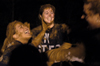 Juniors Brittney Street and Carrie Bradow horse around in a small group during the games at the Young Alums' Midnight Mudness 2005. - Photo by Kathleen Murray