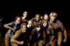 The winning team from Midnight Mudness 2005 flexes their mud muscles. Pictured from left to right: Kari Mynatt, Jennifer Winfield, Tony Winkler, Emily Kuhnert, Whitney Culver, Lindsay Grace Brown, Brittany Stephens,Bethany Little, Jennifer Hanes and Nathan Michael. - Photo by Kathleen Murray