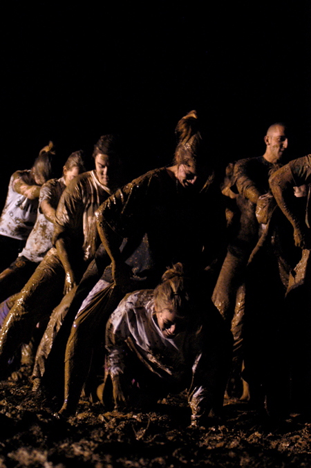 Juniors play leap frog during the Young Alums' annual Midnight Mudness event.