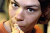 Sophomore Julie Palmer bites into some pizza during finals week. - Photo by Jonathan Blair