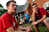 Graduating Seniors Josh Howerton and Wayne Campbell fellowship during the Young Alums' Happy Trails social at the Dockery's. - Photo by Jonathan Blair