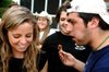 Young Alums Amanda Raley and Bryan Spillman finish off the wings from the wings eating contest during the Young Alums' Happy Trails social at the Dockery's. - Photo by Jonathan Blair