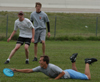 Intramural Ultimate Frisbee Action - SAE Ben Burleson stretches for the disc as Onion David Roach and SAE Kevin Jett look on. - Photo by Jonathan Blair