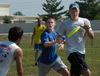 Intramural Ultimate Frisbee Action - LXA Gary Snuffin reaches for the disc while being guarded by Onion Micah Moyers. Onion Broc Barnes and LXA Bryan Spillman look on. - Photo by Kristen Hiller