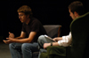 DMS major Nic Pfost talks about his films <i>Shower Story</i>, <i>The Femail Box</i>, and <i>2241</i> with host Eric Murrell during the 2004 Student Film Festival. - Photo by Jonathan Blair