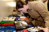 Sophomore Lindsey Abell browses through pictures from winter break GO Trips at the GO Share meeting. - Photo by Lindsay Stavish