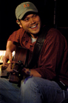 Christian Musician Andrew Peterson flashes a smile during his performance at Union's Homecoming Coffeehouse. - Photo by Kristen Nicole Sayres