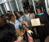 Master of Education graduate LaKeva Thompson poses with her degree during summer graduation. - Photo by Morris Abernathy