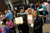 Master of Education graduate Jannina Gaston poses with friends and family after receiving her degree at summer graduation. - Photo by Morris Abernathy