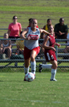 Senior Kari Bachman chases the ball as a defender looks on. - Photo by Morris Abernathy