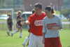 Freshman Nikki Burau looks on as Coach Boylan paints a picture of what she needs to do during the scrimmage. - Photo by Kyle Kurlick