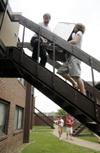 Jim Veneman, director of visual communications, helps his son Nathan Veneman move into the dorms during Freshman Move-In Day. - Photo by Kathleen Murray