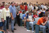 Parents surround their children in prayer at the worship service held on the first day of New Student Orientation.  - Photo by Kyle Kurlick