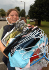 Stephanie Berry hauls in another load of clothes on Freshman Move-In Day. - Photo by Morris Abernathy