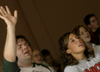 Sophomores Josh Clarke and Candace Cross worship during a chapel service. - Photo by Kathleen Murray