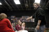 Darren Michael, assistant professor of theatre, talks to his cast a few days before the premiere of <i>Tartuffe</i>. - Photo by Kathleen Murray