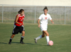 Charity Carter (22) attempts to keep the ball from a Martin Methodist player. - Photo by Steven Aldridge