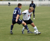 Sophomre Craig Clark battles with a Missouri Baptist player for ball possesion in Union's win. - Photo by Steven Aldridge