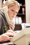 Sophomore Carolyn Negley of Chi Omega makes phone calls for pledges during the Greek Phonathon. - Photo by Kyle Kurlick