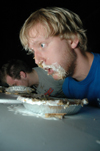 Senior Nathan Michael catches his breath during the Fallapalooza pie eating contest. - Photo by Brad Moore