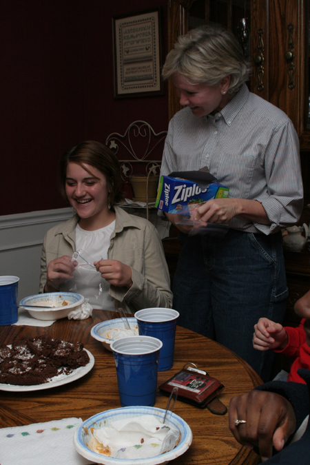Pam Sutton, professor of English, brings out the Ziploc bags for left-overs after a student meal in her home.
