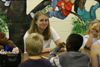 Project Leader Katie Mathis spent time with students at South Elementary during her Day of Remembrance service project. At this project, students ate lunch with and supervised the students as they had a fun filled afternoon with a movie and popcorn while the teachers took a break. - Photo by Derek Ownby