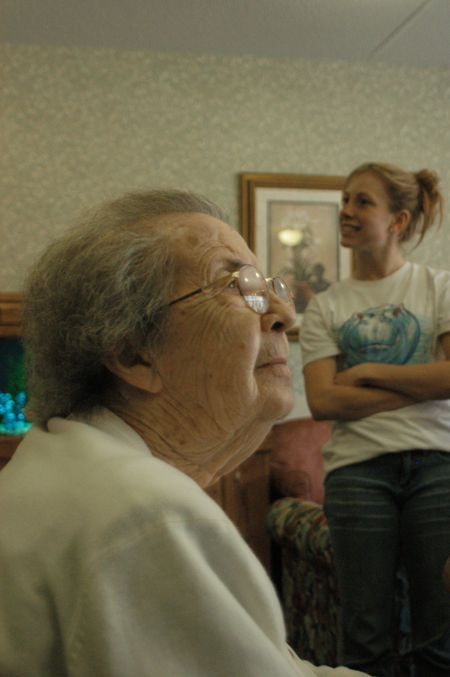 During Remembrance Day a resident of a local nursing home enjoys the company of several Union students.