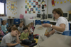 Cindy Kahler, department secretary, spent her Day of Remembrance at Jackson Christian School reading to children. - Photo by Kathleen Murray