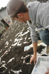 Senior Nathan Morris helped level and mulch space for a peace garden at Parkview Montessori during his Day of Remembrance service project. - Photo by Kristen Nicole Sayres